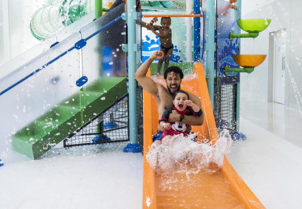 Britannia Leisure Centre dad and daughter on slide