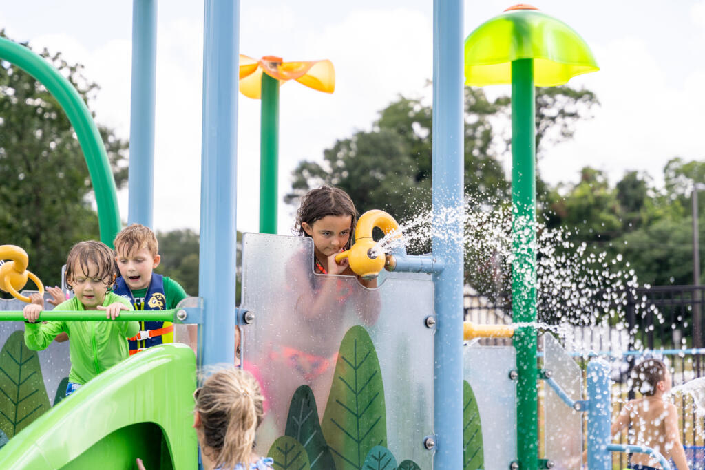 The Future of Public Spaces in a Hotter Climate Children playing at a municipal aquatic play environment.